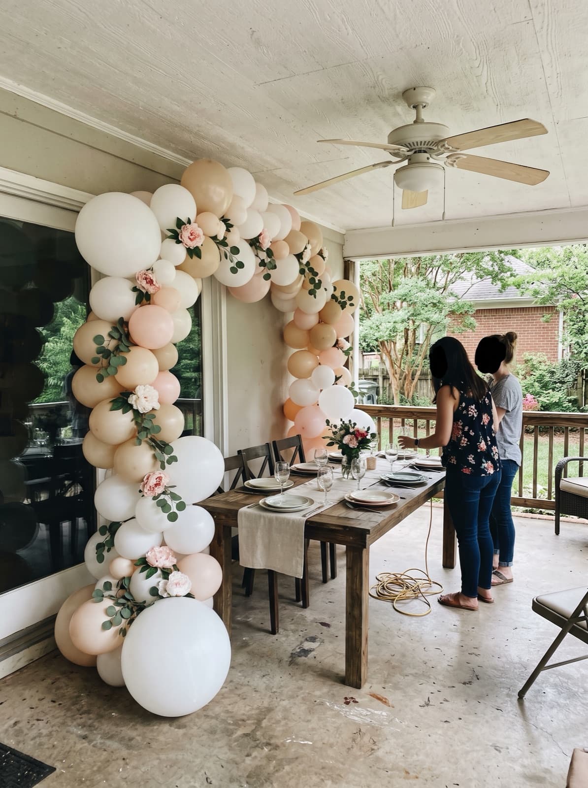 Floral balloon arch with peonies and eucalyptus for a bridal shower